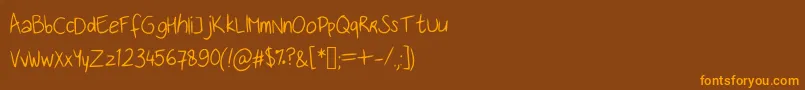 フォントHandwritingfont – オレンジ色の文字が茶色の背景にあります。