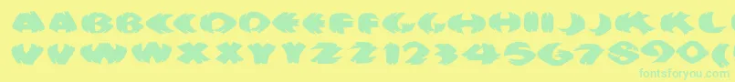 Klitschkotiquaround-Schriftart – Grüne Schriften auf gelbem Hintergrund