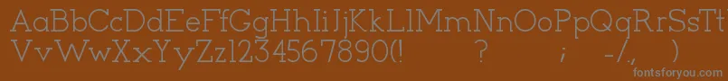 Cyen-Schriftart – Graue Schriften auf braunem Hintergrund