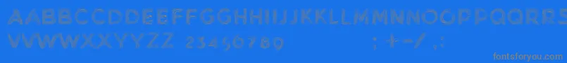 MinkdemoBold-fontti – harmaat kirjasimet sinisellä taustalla