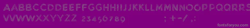 MinkdemoBold-fontti – harmaat kirjasimet violetilla taustalla
