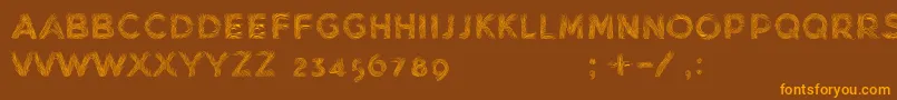 MinkdemoBold-fontti – oranssit fontit ruskealla taustalla