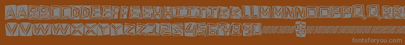 フォントGoldring – 茶色の背景に灰色の文字