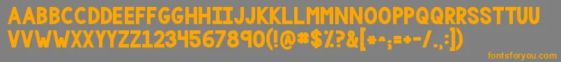 フォントKgonemorelightbig – オレンジの文字は灰色の背景にあります。