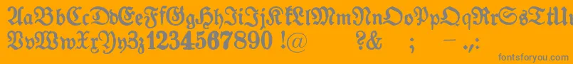 GotykPoszarpany-Schriftart – Graue Schriften auf orangefarbenem Hintergrund