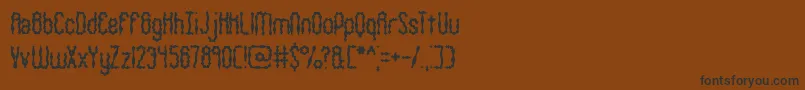 WigglySquigglyBrk Font – Black Fonts on Brown Background