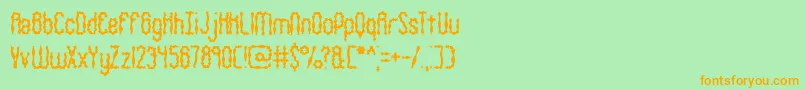 WigglySquigglyBrk-Schriftart – Orangefarbene Schriften auf grünem Hintergrund