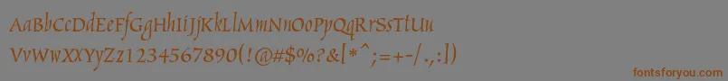 フォントArthurc – 茶色の文字が灰色の背景にあります。