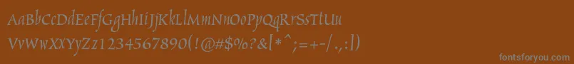 フォントArthurc – 茶色の背景に灰色の文字