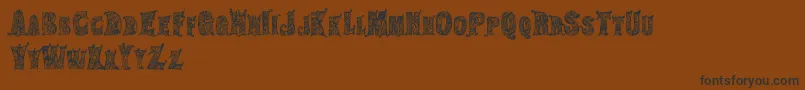 HippiegypsyRegular Font – Black Fonts on Brown Background