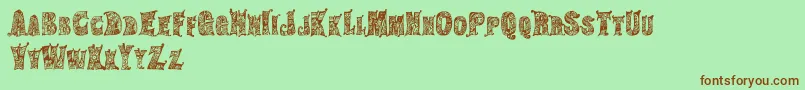 HippiegypsyRegular-Schriftart – Braune Schriften auf grünem Hintergrund