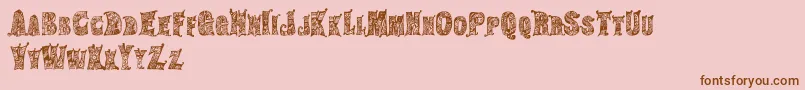 HippiegypsyRegular-Schriftart – Braune Schriften auf rosa Hintergrund