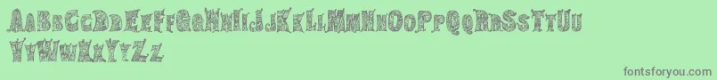 HippiegypsyRegular-Schriftart – Graue Schriften auf grünem Hintergrund