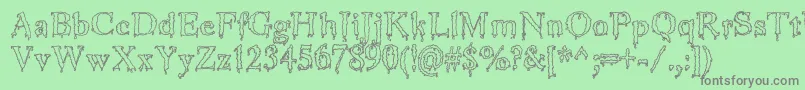 JinkeezOut Font – Gray Fonts on Green Background