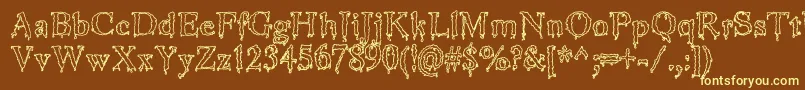 JinkeezOut Font – Yellow Fonts on Brown Background