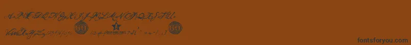 OlhoDeBoi-Schriftart – Schwarze Schriften auf braunem Hintergrund