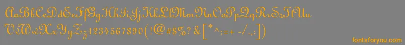 フォントMonasteryScriptSsi – オレンジの文字は灰色の背景にあります。