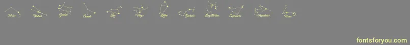 ConstellationsOstia-Schriftart – Gelbe Schriften auf grauem Hintergrund