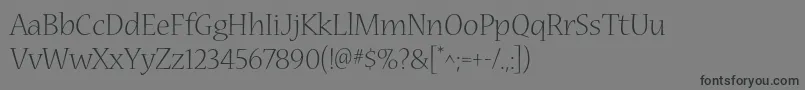 NuevastdLight Font – Black Fonts on Gray Background