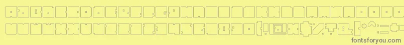 Fonte BlockHollow – fontes cinzas em um fundo amarelo