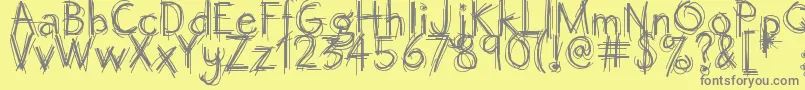 Octemberscript Font – Gray Fonts on Yellow Background