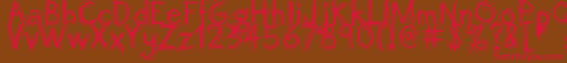 Octemberscript Font – Red Fonts on Brown Background
