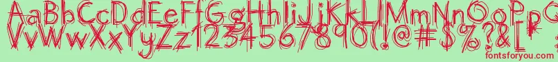 フォントOctemberscript – 赤い文字の緑の背景