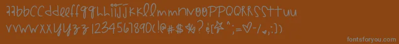 Czcionka Hyperpunchpink – szare czcionki na brązowym tle