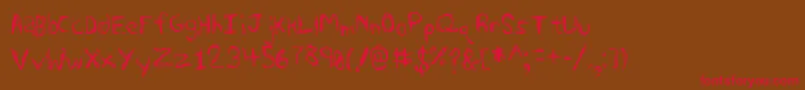 フォントSharkscribble – 赤い文字が茶色の背景にあります。