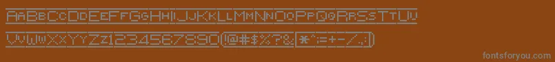 Czcionka Pixelflag – szare czcionki na brązowym tle