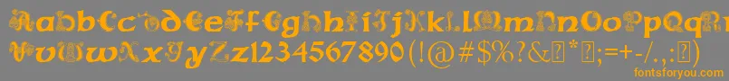 PaulsCelticFont2-Schriftart – Orangefarbene Schriften auf grauem Hintergrund