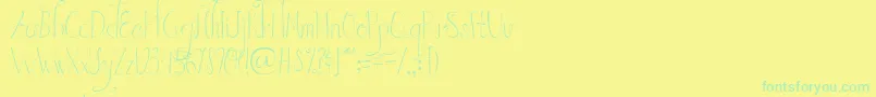 AustieBostInWonderland Font – Green Fonts on Yellow Background
