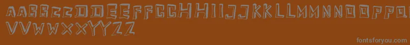 Шрифт TobyfontEmpty – серые шрифты на коричневом фоне