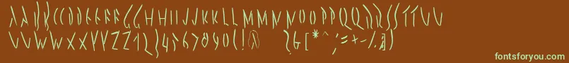 フォントPompejimk – 緑色の文字が茶色の背景にあります。