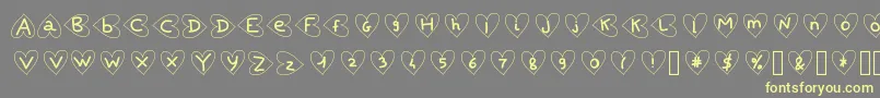 Saintvalentin-Schriftart – Gelbe Schriften auf grauem Hintergrund