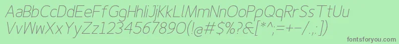 Finenessproextralightitalic-Schriftart – Graue Schriften auf grünem Hintergrund