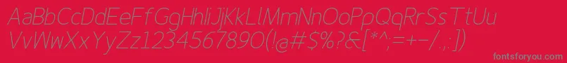 Finenessproextralightitalic-Schriftart – Graue Schriften auf rotem Hintergrund