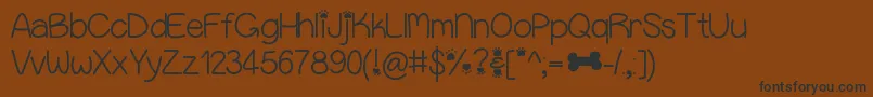 Puppybellies-Schriftart – Schwarze Schriften auf braunem Hintergrund