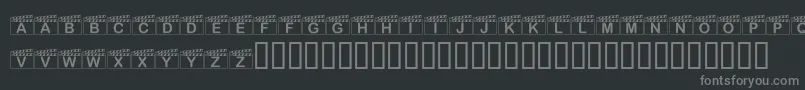 フォントKrAction – 黒い背景に灰色の文字