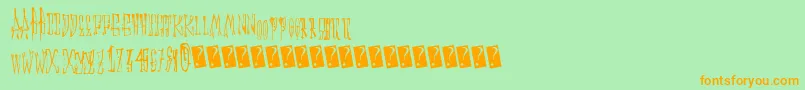 Animalcracker-Schriftart – Orangefarbene Schriften auf grünem Hintergrund