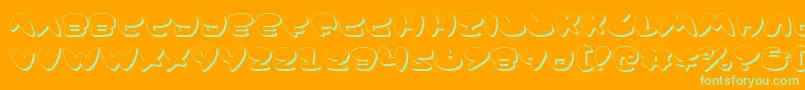 JacksonShadow-Schriftart – Grüne Schriften auf orangefarbenem Hintergrund