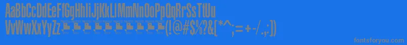YacarenaUltraPersonalUse-fontti – harmaat kirjasimet sinisellä taustalla