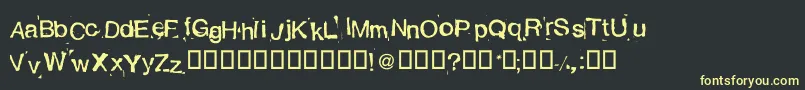 AlexandrasStempelkasten Font – Yellow Fonts on Black Background