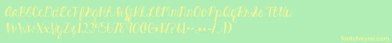 フォントKghardcandysolid – 黄色の文字が緑の背景にあります
