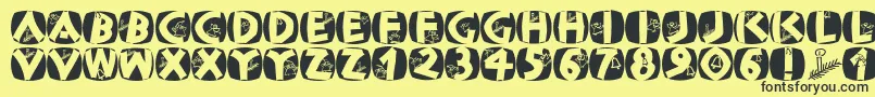 Classicapsxmas2002 Font – Black Fonts on Yellow Background