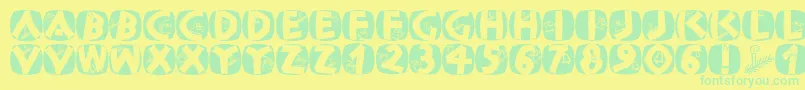 Classicapsxmas2002 Font – Green Fonts on Yellow Background