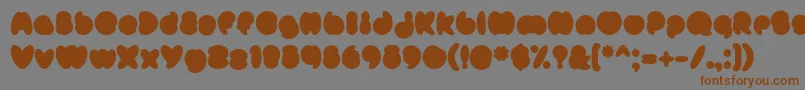 フォントMisterLoopyFill – 茶色の文字が灰色の背景にあります。