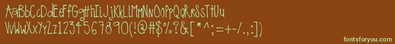 フォントMrfOnTheEdgeOfCrazy – 緑色の文字が茶色の背景にあります。
