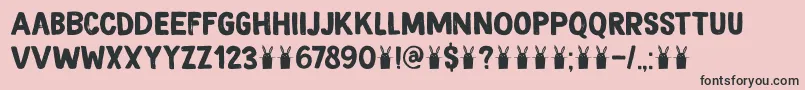 フォントDkMagicalBrush – ピンクの背景に黒い文字