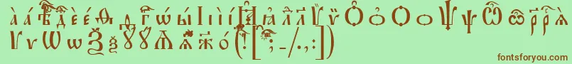 IrmologionUcsSpacedout-Schriftart – Braune Schriften auf grünem Hintergrund